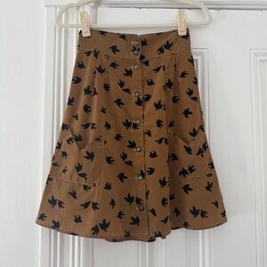 Elegant Tan A-Line Skirt with Bird Print
